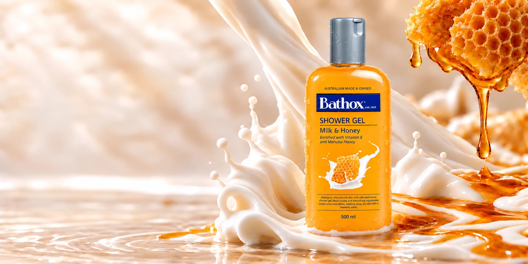 The approved Milk & Honey bottle surrounded by milk and golden honey.